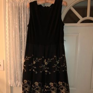 Knee length black and gold dress